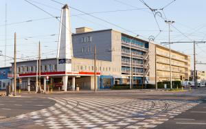 an empty street in front of a large building at Antwerp Harbour Hotel in Antwerp