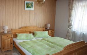 En eller flere senge i et værelse på Ferienwohnung Dichtl