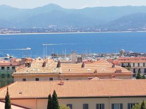 a view of a city with buildings and the water at Villa Cécile in Ajaccio