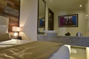 Postel nebo postele na pokoji v ubytování BUSINESS HOTEL SFAX