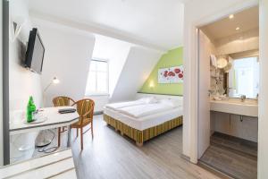 Postel nebo postele na pokoji v ubytování Hotel Stadtkrug