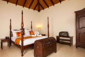 Postel nebo postele na pokoji v ubytování Old Kent Estates & Spa, Coorg