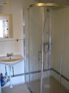 a bathroom with a shower and a sink at Bergen Camping Park in Bergen