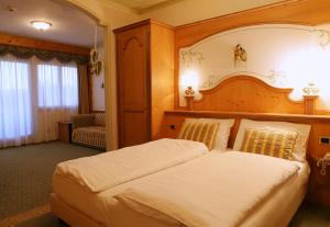 Postel nebo postele na pokoji v ubytování Hotel Belvedere Srl