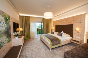Postel nebo postele na pokoji v ubytování Thermenhotel PuchasPLUS Stegersbach + 37 fotografií