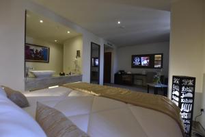 Ένα ή περισσότερα κρεβάτια σε δωμάτιο στο BUSINESS HOTEL SFAX