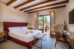 Кровать или кровати в номере Es Moli Hotel