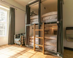 a room with two bunk beds and a window at CoDE Pod – The CoURT - Edinburgh in Edinburgh