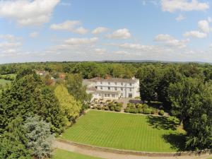 an aerial view of a house with a large lawn at Rowton Hall Hotel and Spa in Chester