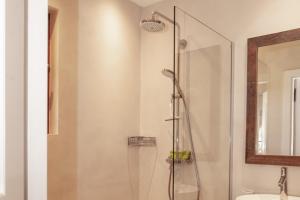 a bathroom with a shower and a sink at Les Pins de l'Escalet in Ramatuelle +13 photos