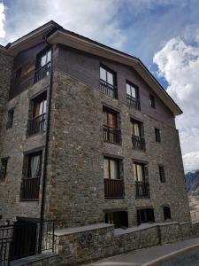 a brick building with balconies on the side of it at Soldeu Paradis Tarter Alt in Canillo