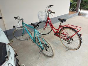 two bikes are parked next to each other at Maruay in Suratthani