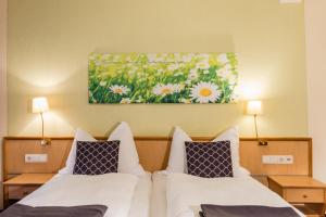 Postel nebo postele na pokoji v ubytování Hotel Wiesenhof