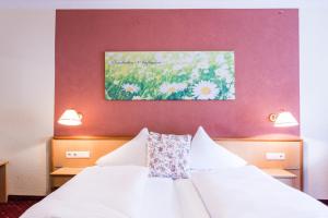 Łóżko lub łóżka w pokoju w obiekcie Hotel Wiesenhof
