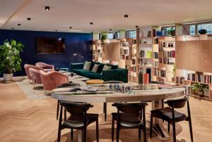 a living room filled with furniture and a table at Sir Victor Hotel in Barcelona