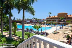 a view of the pool from the balcony of a resort at Apartamento Ocean View in Puerto de Santiago