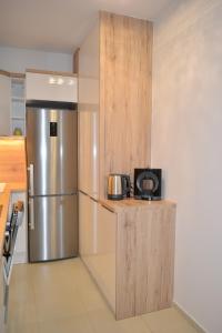 Kuchyňa alebo kuchynka v ubytovaní SUN-DIAL APARTMAN