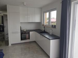 Kuchyň nebo kuchyňský kout v ubytování sandra1 + 5 fotografií