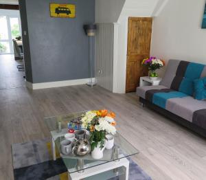 a living room with a couch and a coffee table at Westeria Cottage in Barnstaple