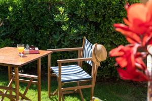 a table and a chair with a glass of orange juice at Apartaments Beach & Golf Resort in Pals