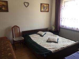 Postel nebo postele na pokoji v ubytování Pokoje Gościnne Szymon