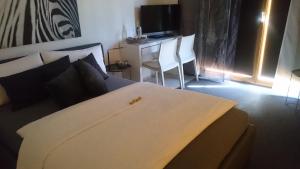 Postel nebo postele na pokoji v ubytování K82 BNB & Hotel