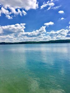 a view of a large body of water at Mazurska Villa Deluxe w Pasymiu z prywatnym pomostem na jezioro Kalwa i łodzią na wyłączność Najwyższe Premium w Osada Zamkowa in Pasym