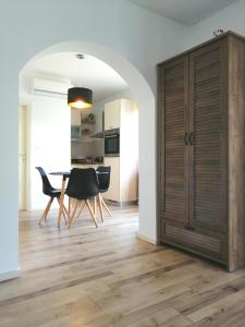 a kitchen and dining room with a table and chairs at Apartment Gabi in Umag