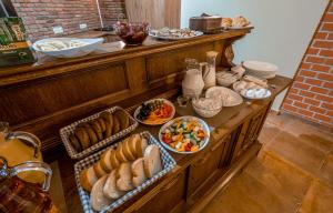 a buffet with bread and other food on a table at Golden Light Hotel in Tbilisi City