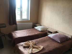 Postel nebo postele na pokoji v ubytování Mini gostinitsa HOSTEL