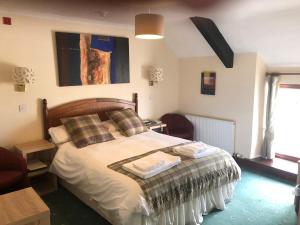 Ένα ή περισσότερα κρεβάτια σε δωμάτιο στο Raleghs Cross Inn +14 φωτογραφίες