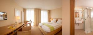 Postel nebo postele na pokoji v ubytování Hotel St Elisabeth