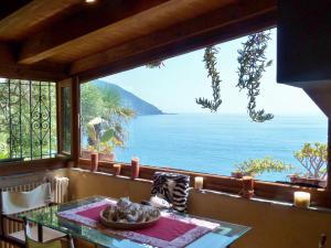 a view of the ocean from the balcony of a house at Le case di Recco by Holiday World in Recco