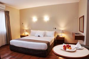 Postel nebo postele na pokoji v ubytování DM Hoteles Nasca