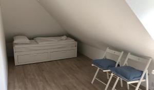 Ein Bett oder Betten in einem Zimmer der Unterkunft Budapester Hof Gästehaus