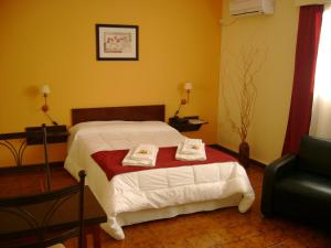 Giường trong phòng chung tại Hotel Minas