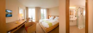 Postel nebo postele na pokoji v ubytování Hotel St Elisabeth