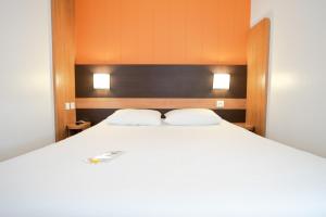 Letto o letti in una camera di Première Classe Lyon Sud - A7