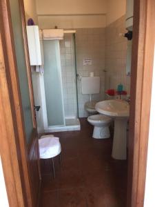 a bathroom with a toilet and a sink at Agriturismo Cargandino in Mezzomerico