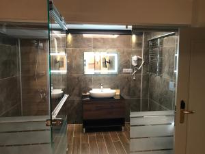 a bathroom with a sink and a shower at Muyan Suites in Istanbul +48 photos