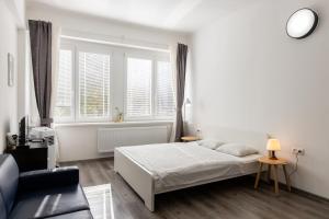 A bed or beds in a room at Best View Apartments
