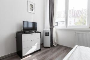 A television and/or entertainment centre at Best View Apartments