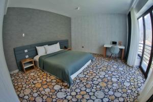 Yurd Hotel客房内的一张或多张床位