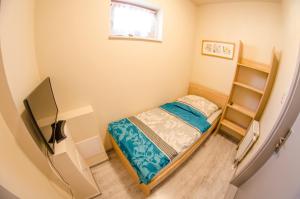 Ein Bett oder Betten in einem Zimmer der Unterkunft Kolibri Panzió