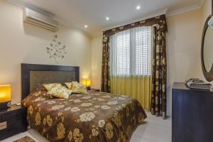 Posteľ alebo postele v izbe v ubytovaní Villa La Caleta Golf