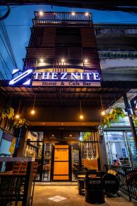 a fire nine hotel and cafe bar at night at The Z Nite Hostel in Phuket