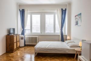 A bed or beds in a room at Best View Apartments