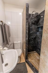 A bathroom at Best View Apartments