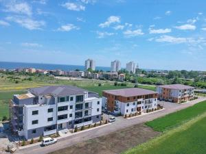 an aerial view of a city with buildings and the ocean at Apartament CAMEL in Eforie Nord
