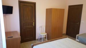 Postel nebo postele na pokoji v ubytování Villa Erry